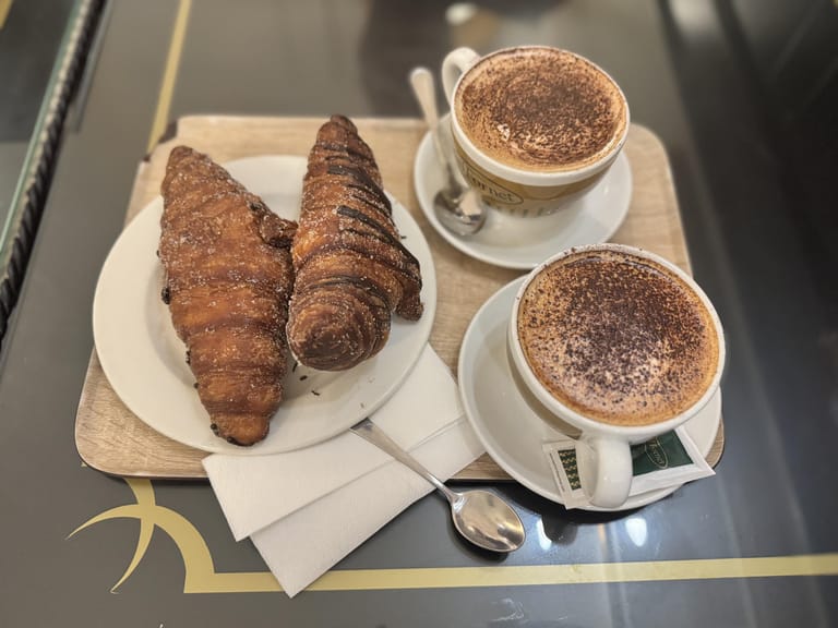 Cappuccino and croissants at a cafe